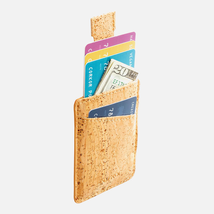 Side view of Corkor CK241 light brown vegan cork card sleeve wallet, showcasing multiple cards and cash in a compact, eco-friendly design with a convenient pull-tab for easy access.