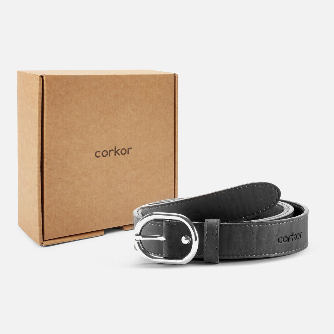 Black Corkor vegan cork belt with silver buckle displayed alongside eco-friendly packaging box.