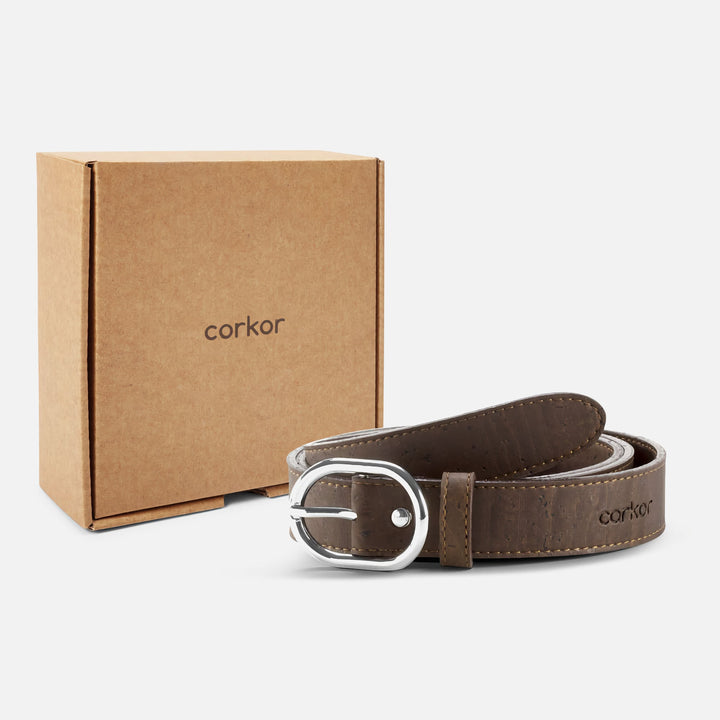 Dark brown Corkor vegan cork belt with silver buckle displayed alongside eco-friendly packaging box.