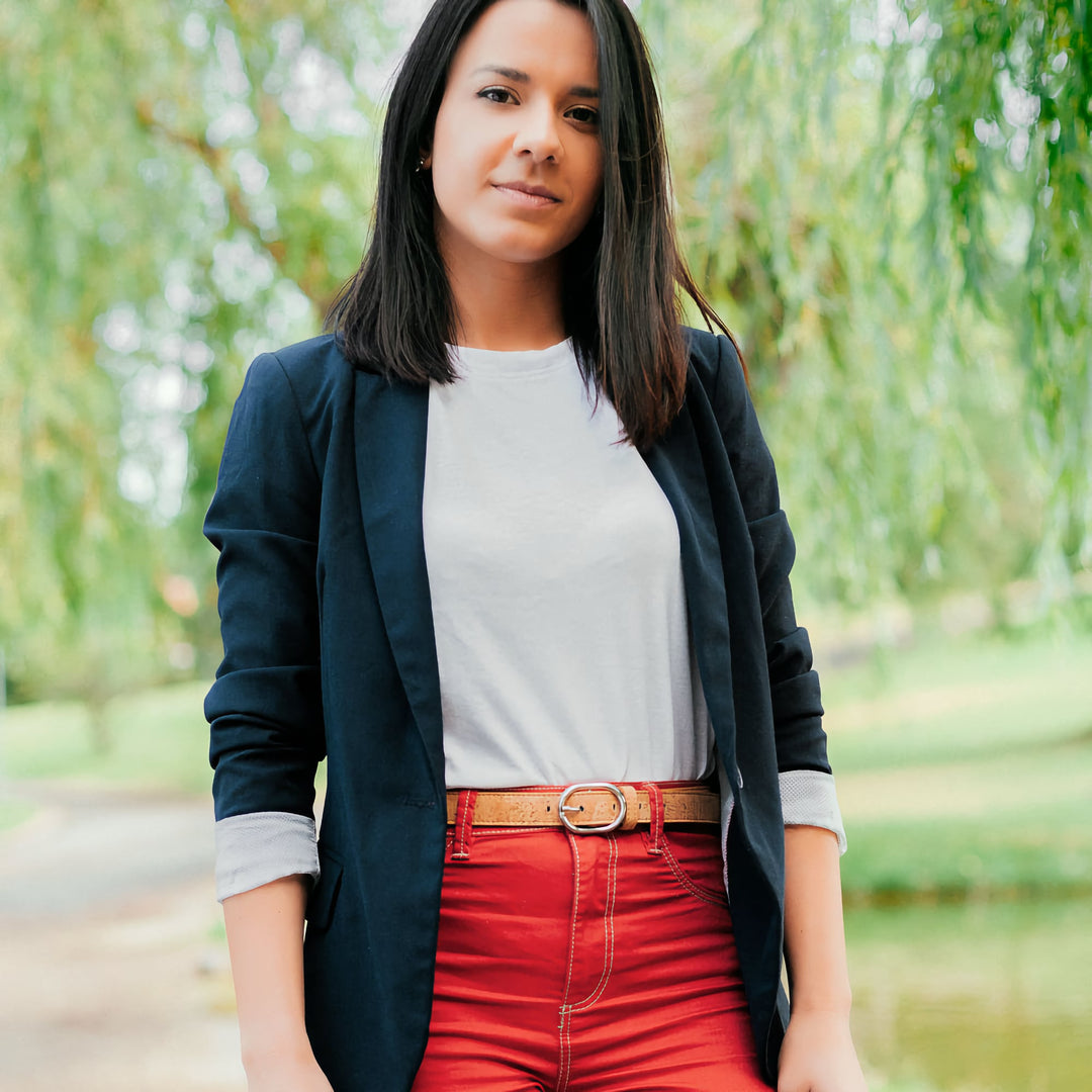 Woman wearing a light brown Corkor vegan cork belt with a casual outfit.