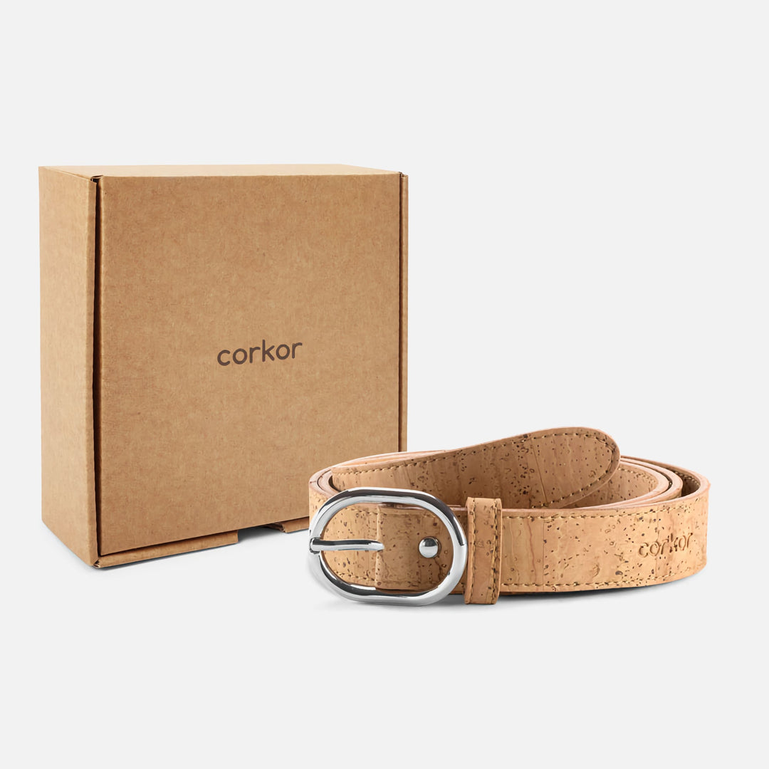 Light brown Corkor vegan cork belt with silver buckle displayed next to eco-friendly packaging box.