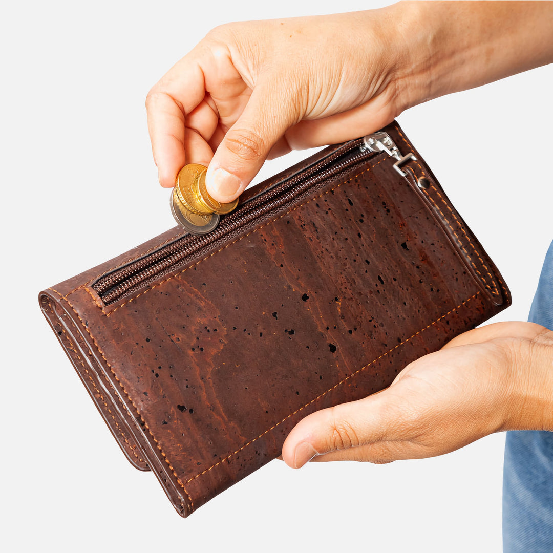 Corkor Vegan Cork Women's Slim Wallet with a secure zippered pocket, perfect for storing coins, shown in use.