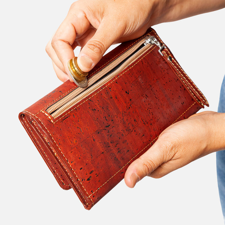 Corkor Vegan Cork Women's Slim Wallet with a secure zippered pocket, perfect for storing coins, shown in use.