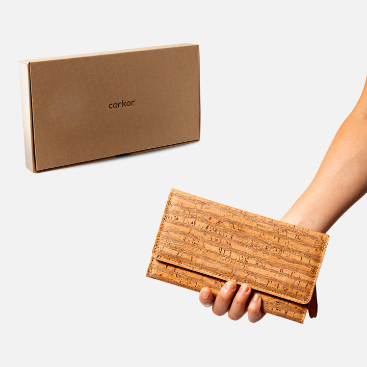 Corkor Vegan Cork Women's Slim Wallet in zebra cork pattern, shown with eco-friendly packaging and hand-held display.