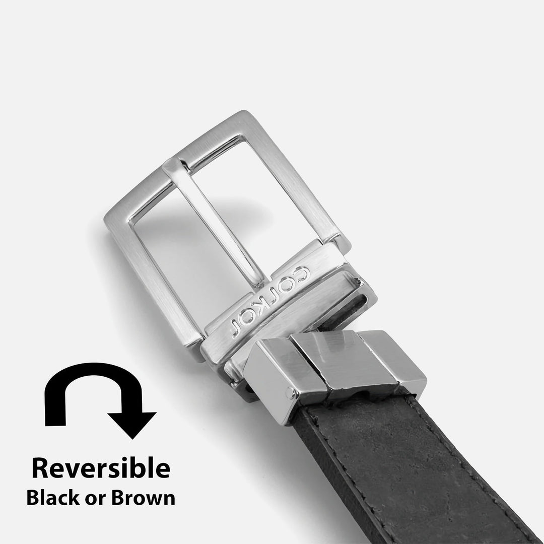 Corkor reversible black and brown belt with silver buckle, shown in a close-up of the reversing mechanism
