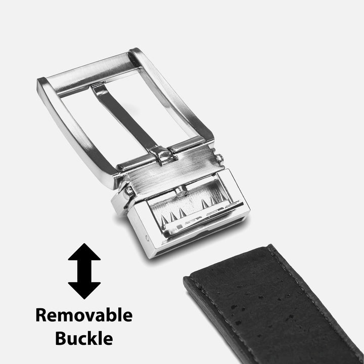 Close-up of a silver removable belt buckle detached from a black belt strap