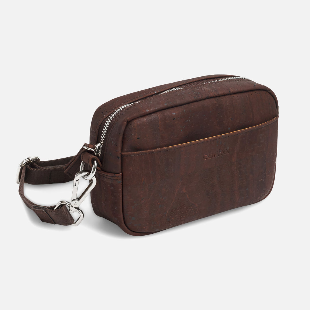Corkor Vegan Cork Crossbody Pouch Horizontal in dark brown cork leather with front pocket, zipper closure, and adjustable strap hardware