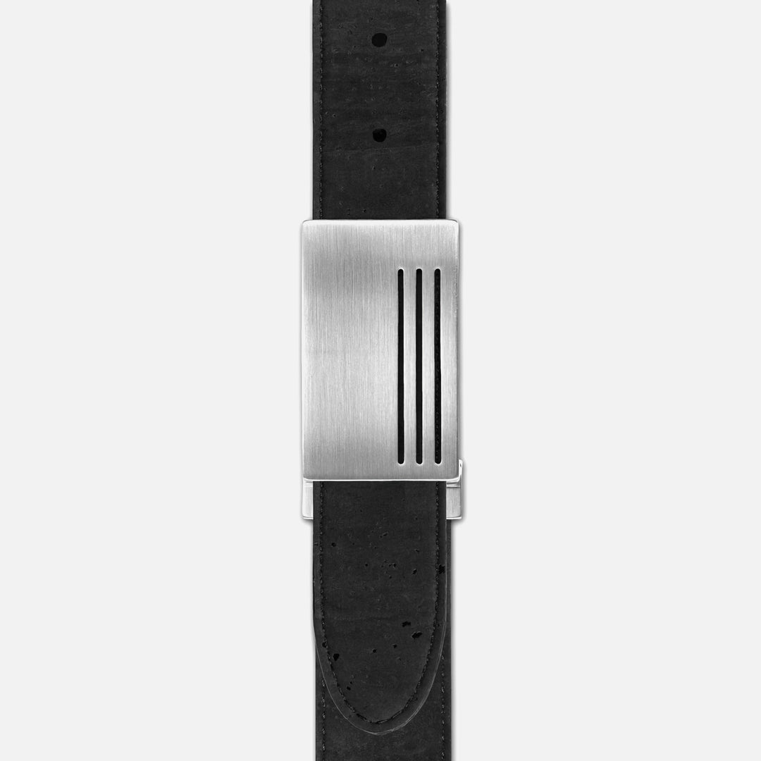Close-up of Corkor vegan men's reversible cork belt in black with brushed silver plaque buckle, eco-friendly and durable
