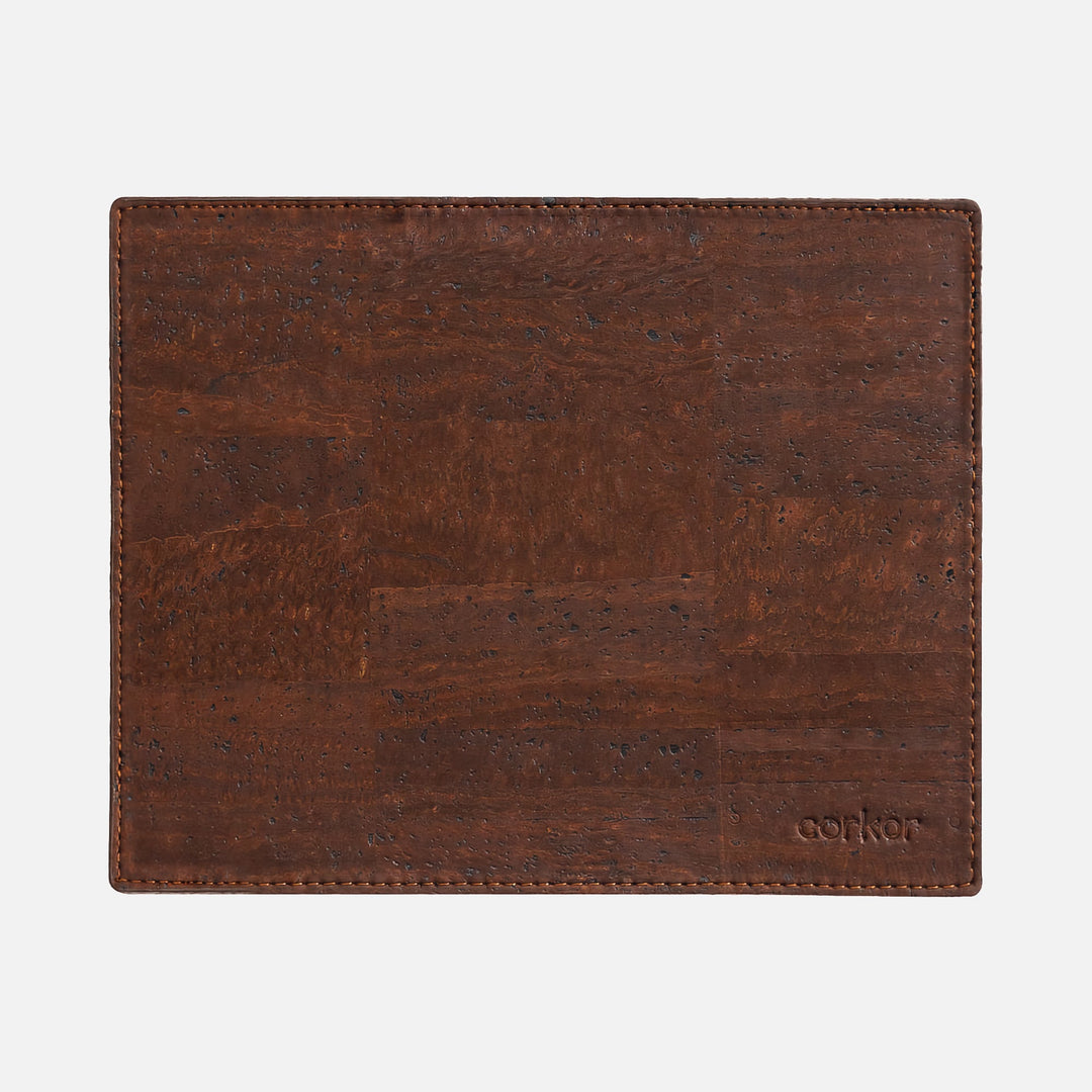 Corkor dark brown mouse pad with stitched edges and embossed logo, shown flat from above