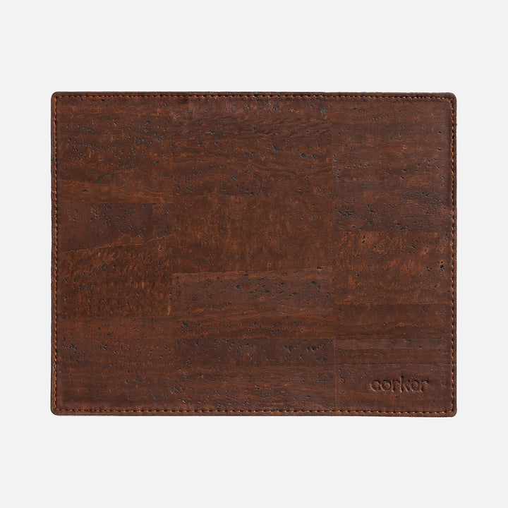 Corkor dark brown mouse pad with stitched edges and embossed logo, shown flat from above