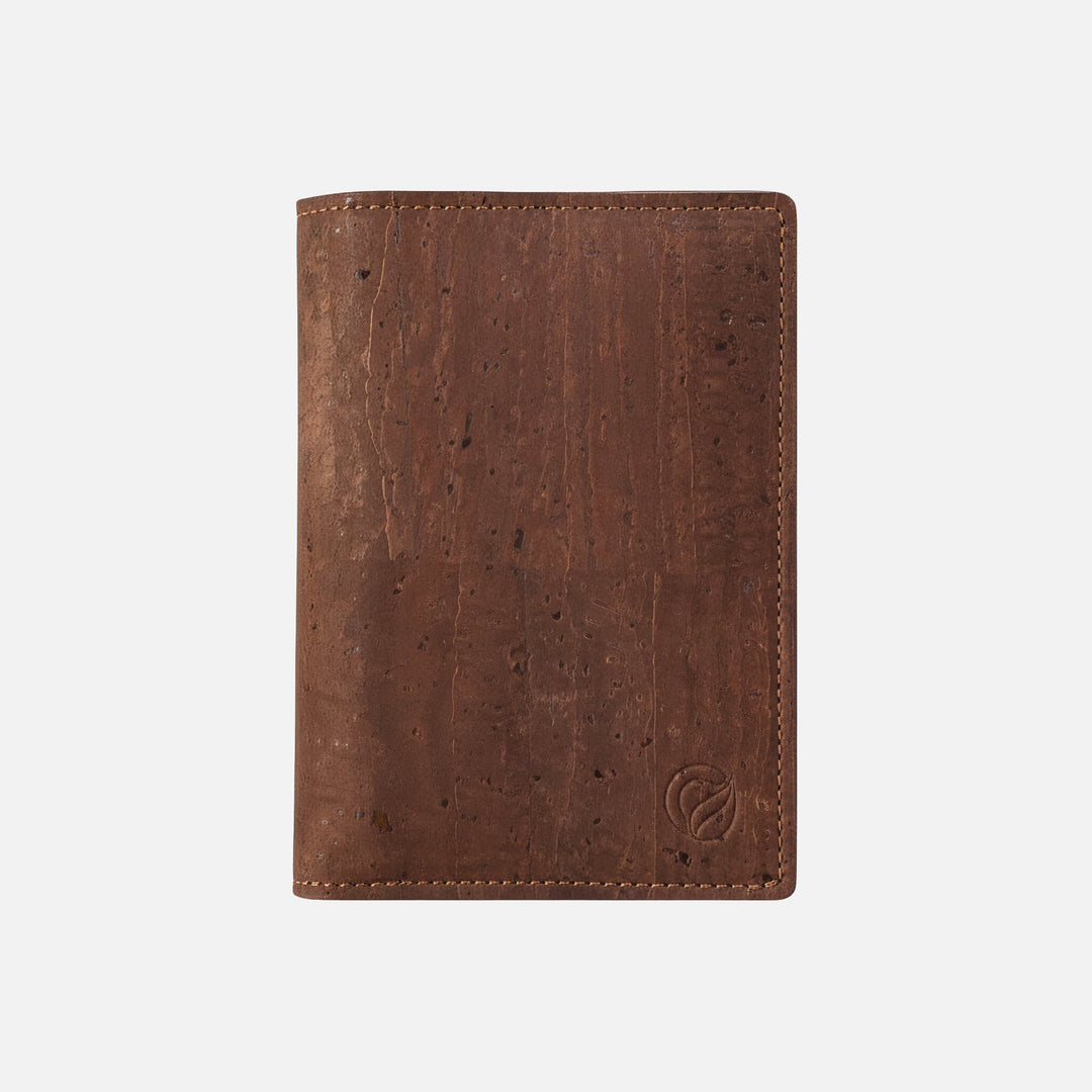 Corkor Vegan Cork Passport Wallet in Dark Brown, front view showing natural cork texture and stitched edge design