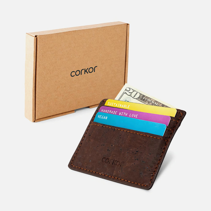 Corkor Vegan Cork Slim Cardholder in dark brown shown with eco-friendly cardboard packaging, displaying cards and cash