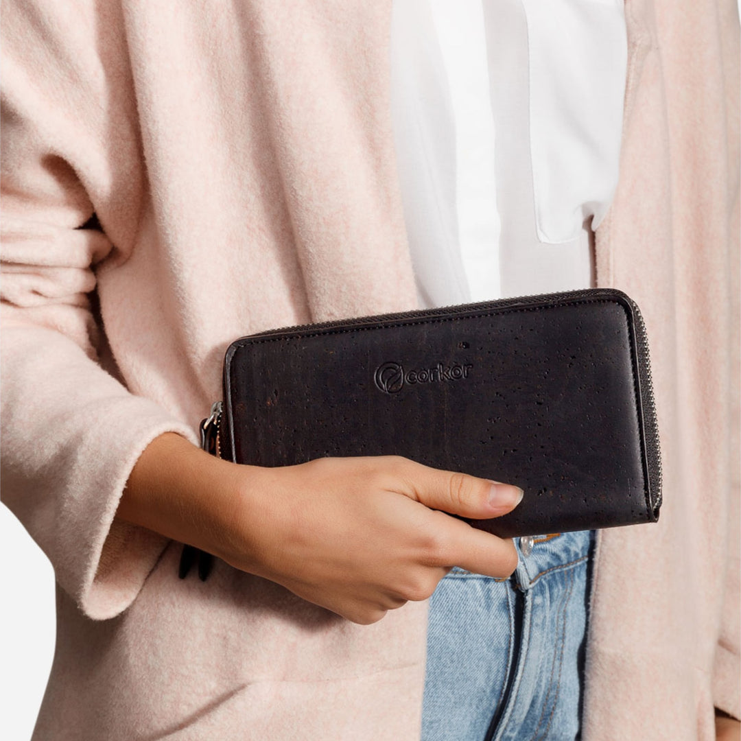 Woman holding Corkor Vegan Cork Women's Long Wallet in black, showcasing its elegant and eco-friendly design for daily use.