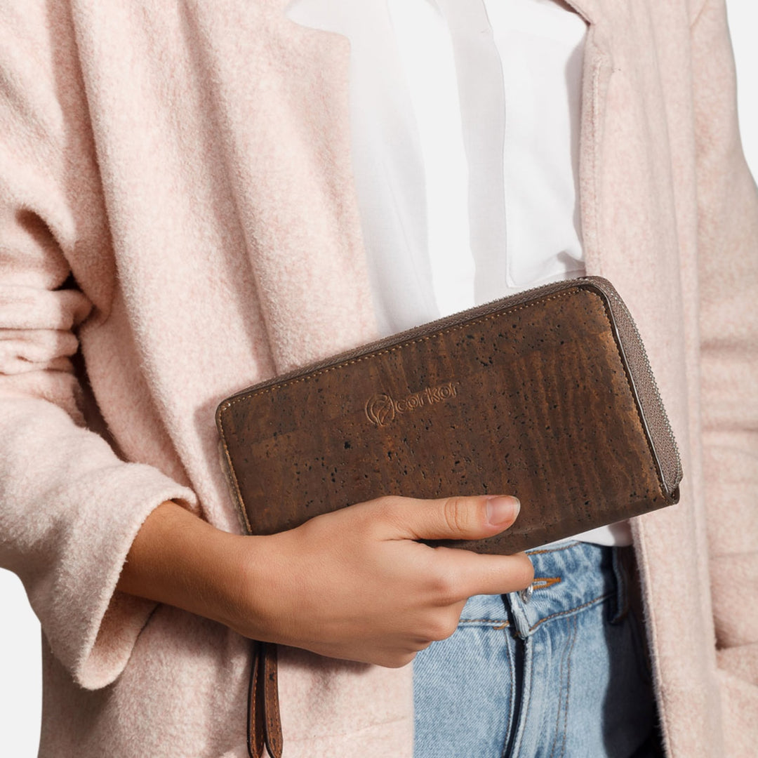 Woman holding Corkor Vegan Cork Women's Long Wallet in dark brown, showcasing its elegant and eco-friendly design for daily use.