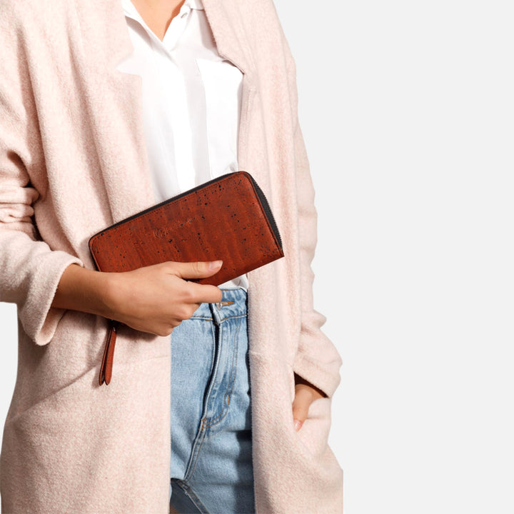 Woman holding Corkor Vegan Cork Women's Long Wallet in red, showcasing its elegant and eco-friendly design for daily use.