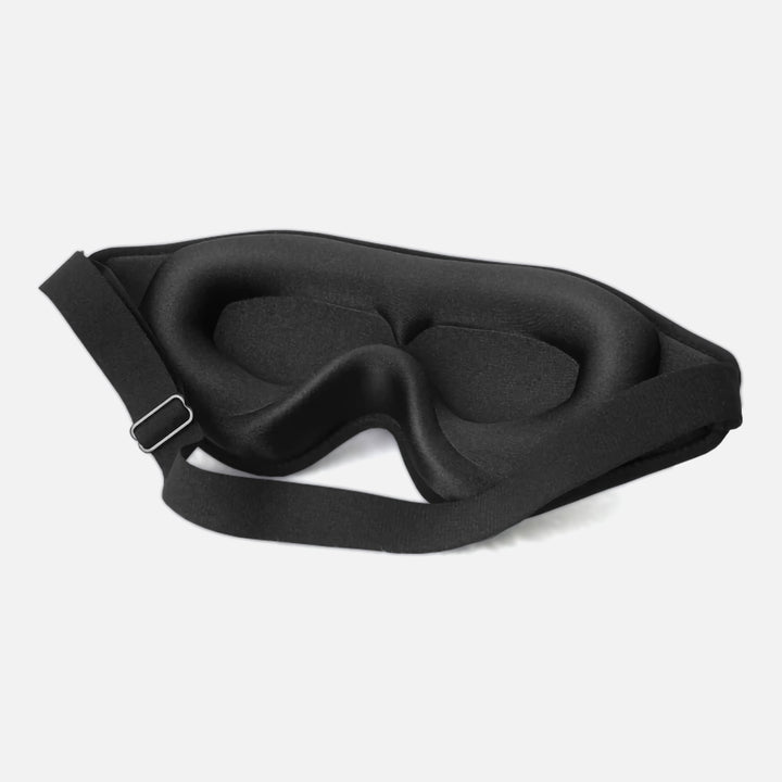 DreamEase 3D Sleep Mask in black, featuring ergonomic design, memory foam, and light-blocking benefits for restful sleep.