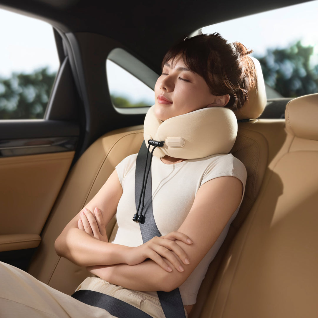 Woman resting in car with EVERYTHINK ES2 travel neck pillow, providing full neck support for comfortable naps during travel