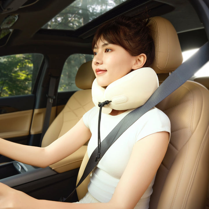 Woman driving with EVERYTHINK ES2 travel neck pillow, offering ergonomic support and comfort for long-distance road trips
