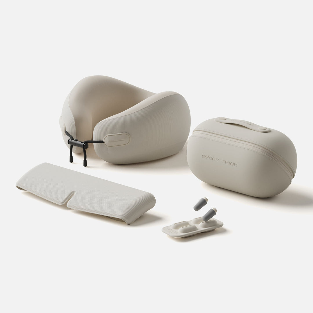 EVERYTHINK EV2 Travel Capsule set in Ivory White with neck pillow, eye mask, earplugs, and storage case