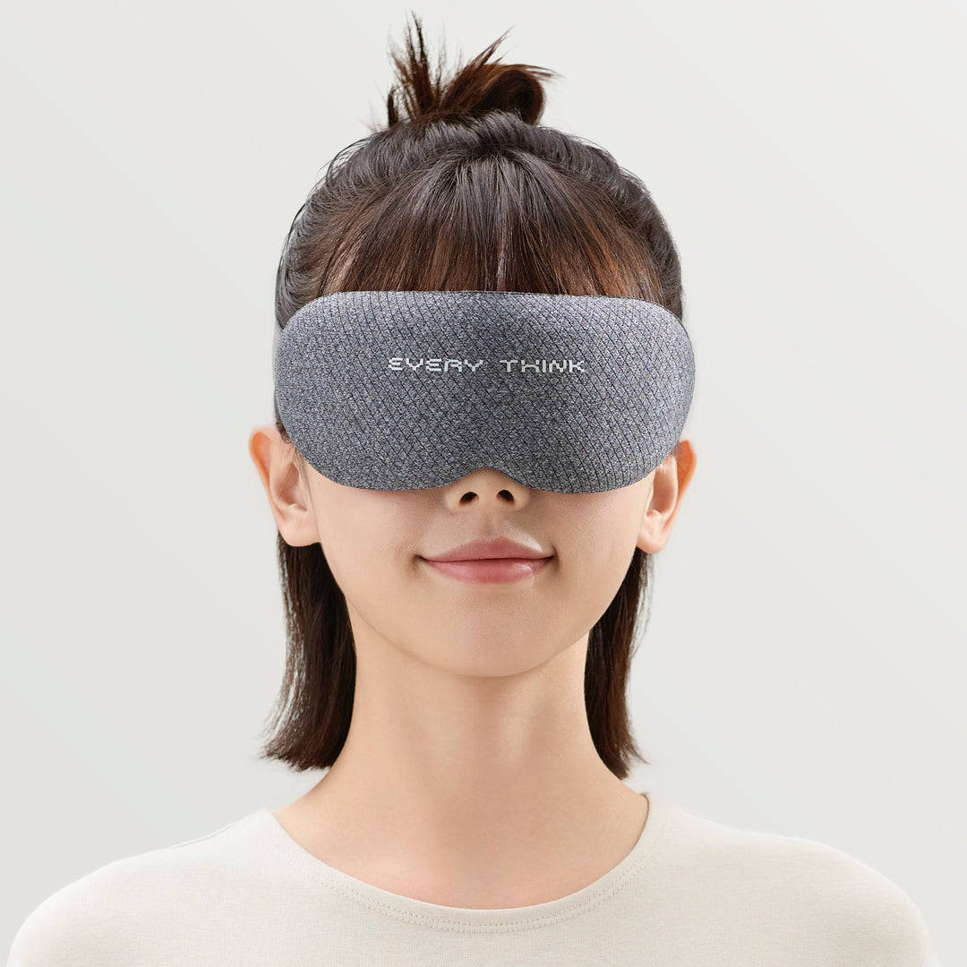 Close-up front view of woman wearing EVERYTHINK VE2 3D blackout sleep mask in gray