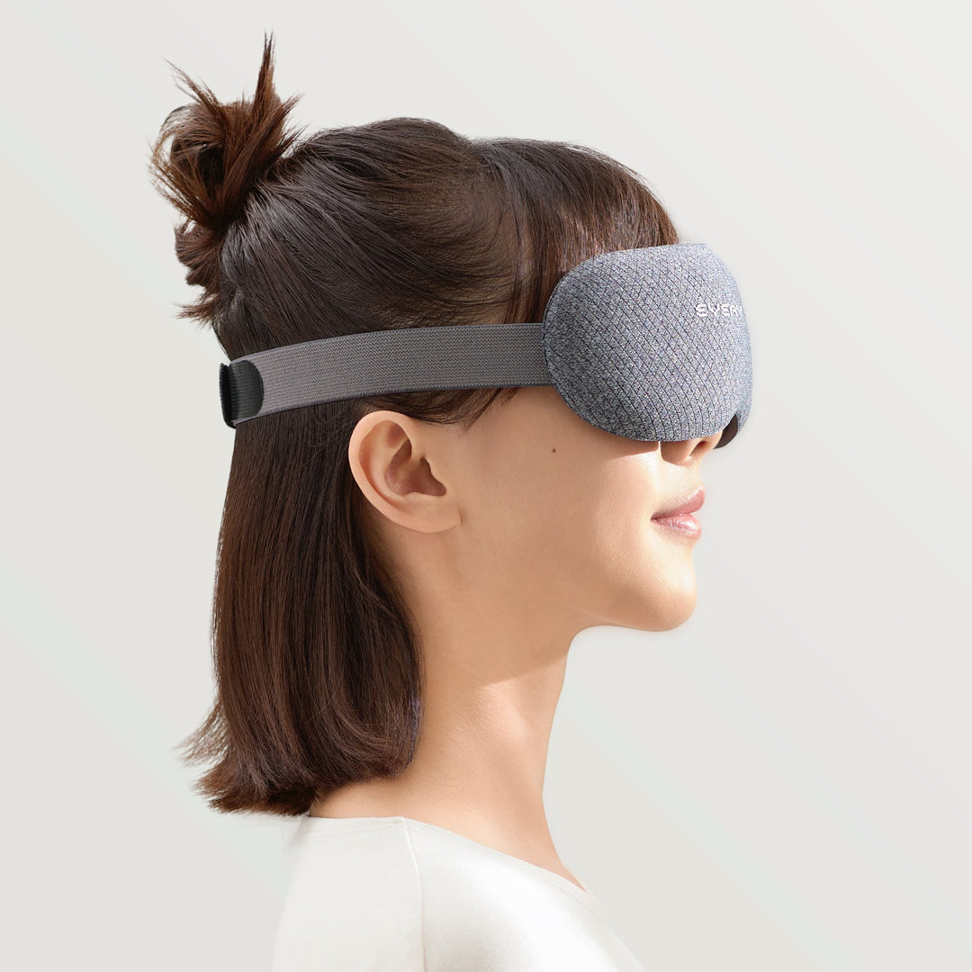 Side view of woman wearing EVERYTHINK VE2 3D blackout sleep mask in gray with adjustable strap