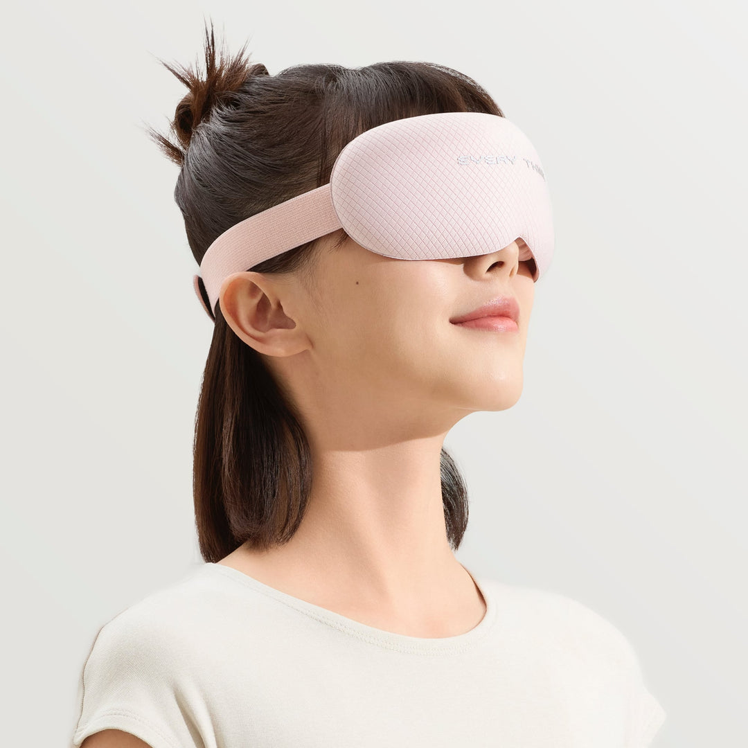 Woman wearing EVERYTHINK VE2 3D Blackout Sleep Mask in pink, side view showing comfortable fit and full coverage