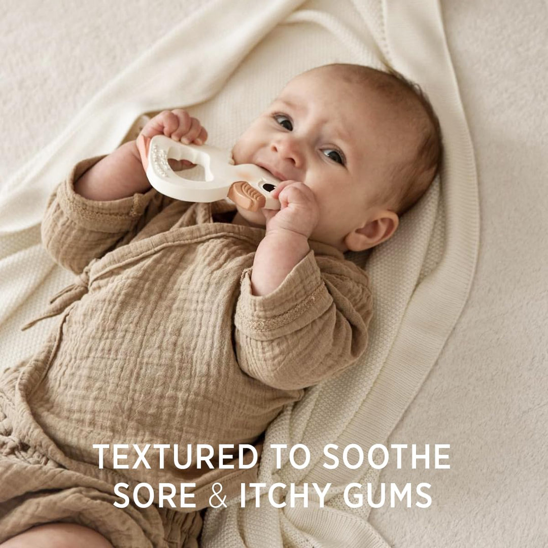 Baby using HEVEA Kawan Duck Teether with textured surface to soothe sore and itchy gums during teething