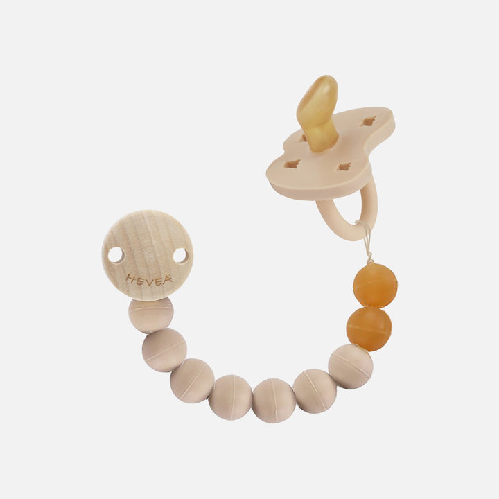 Hevea Sand pacifier holder with beige and amber beads, wooden clip and pacifier attached