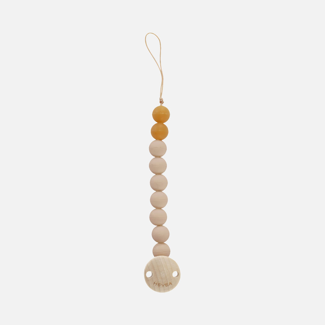 Hevea Sand pacifier holder with beige and amber beads, loop cord and round wooden clip