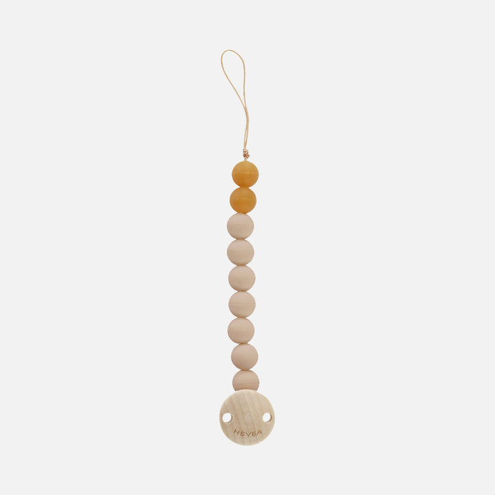 Hevea Sand pacifier holder with beige and amber beads, loop cord and round wooden clip