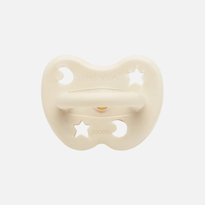 Hevea milky white pacifier back view with moon and star ventilation holes