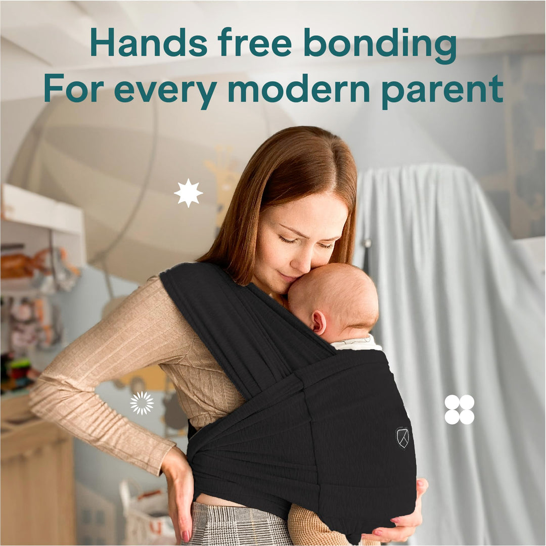 Mother wearing Koala Babycare Koala Cuddle Band in black, promoting hands-free bonding for modern parents.