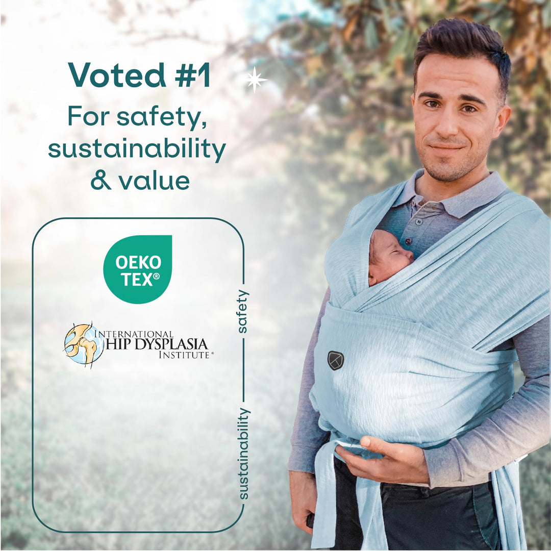 Father using Koala Babycare Koala Cuddle Band in light blue, certified by OEKO-TEX and International Hip Dysplasia Institute for safety.