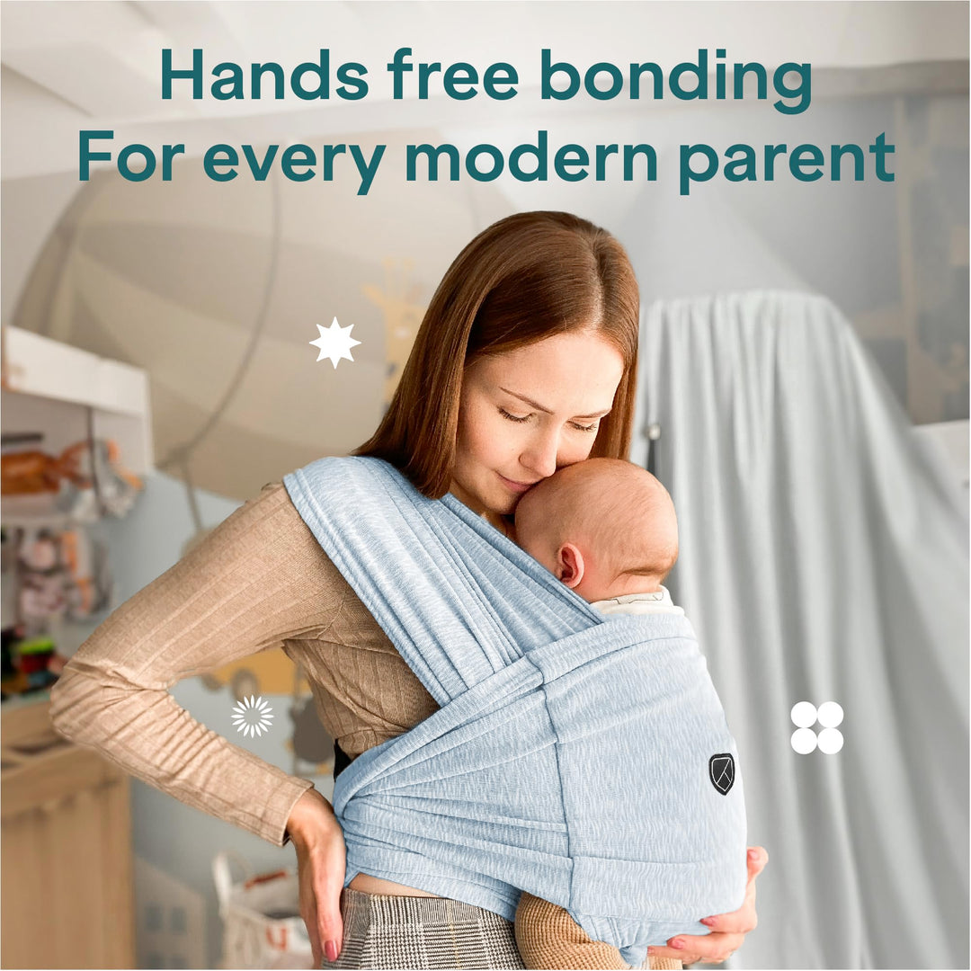 Mother using Koala Babycare Koala Cuddle Band in light blue, offering hands-free bonding for modern parents with ergonomic support.