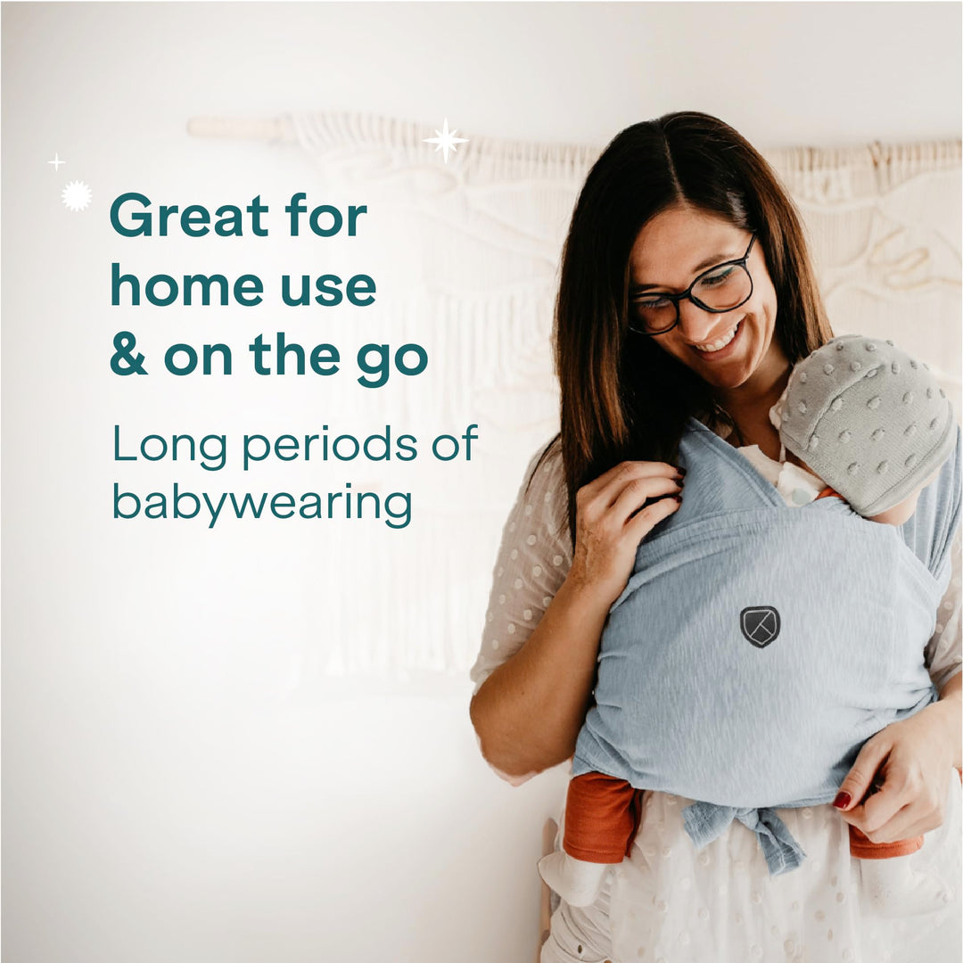 Mother using Koala Babycare Koala Cuddle Band in light blue, ideal for home use and on-the-go, designed for long periods of babywearing.