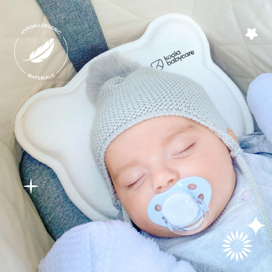 Sleeping baby on Koala Babycare Koala Perfect Head pillow in white, highlighting hypoallergenic materials for safe and gentle support.