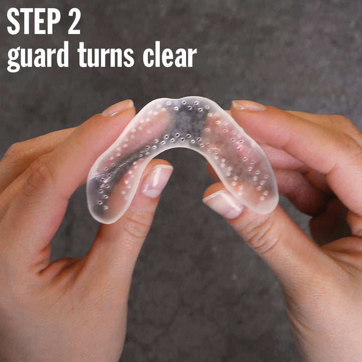 LunaGuard Nighttime Dental Guard turns clear after heating, indicating it's soft and ready for molding in step 2 of the fitting process.