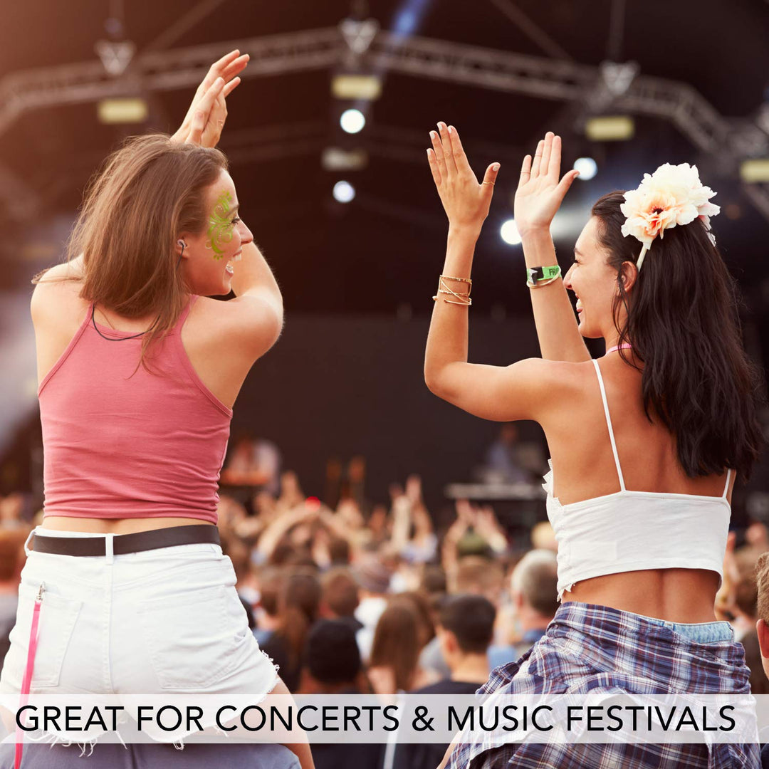 Two women enjoying a music festival, one wearing Mack&