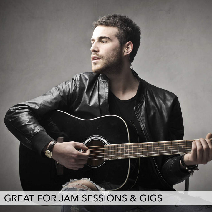 Man playing acoustic guitar during a jam session while wearing Mack&