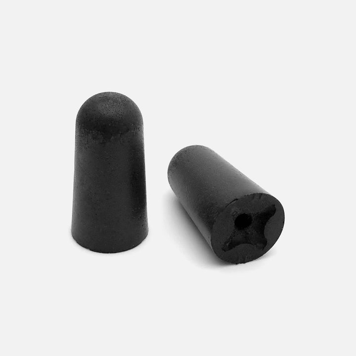 Close-up of Mack's Covert Ops Soft Foam Shooting Earplugs black tapered design NRR 32 dB hearing protection
