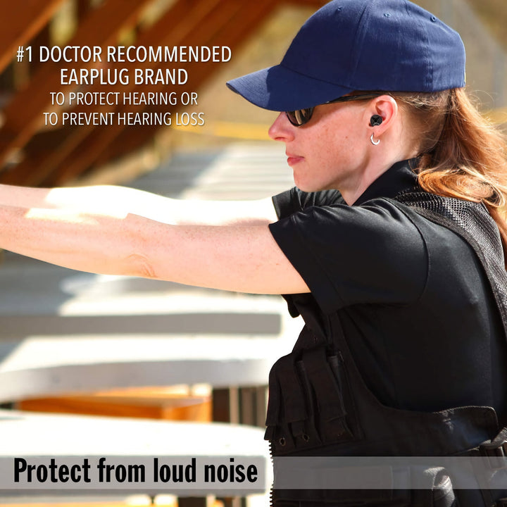Shooter wearing Mack's Covert Ops Soft Foam Shooting Earplugs black NRR 32 dB hearing protection from loud gunfire
