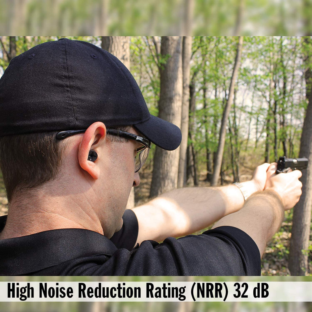Shooter wearing Mack's Covert Ops Soft Foam Shooting Earplugs with NRR 32 dB hearing protection during target practice