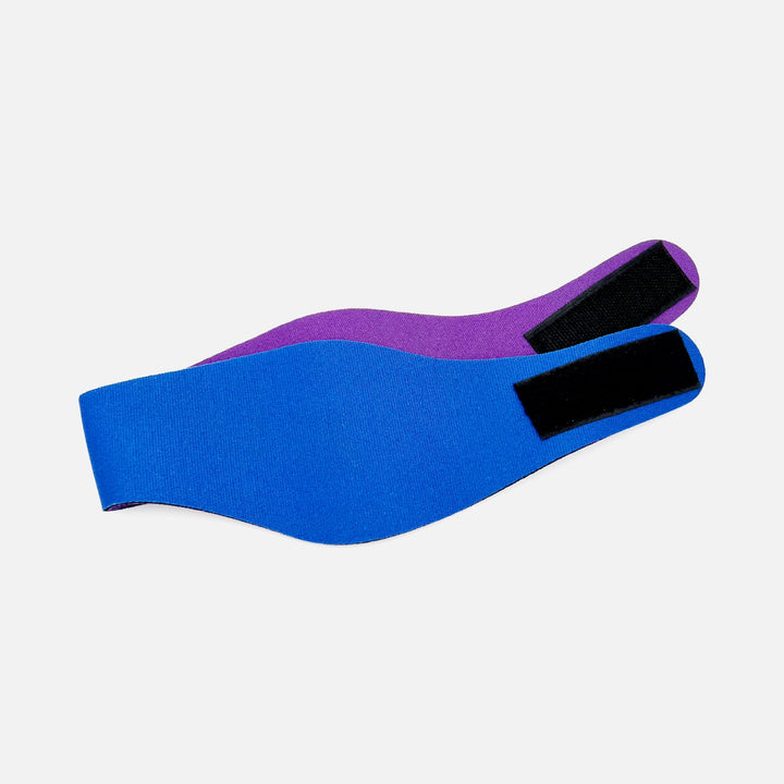 Back view of Mack's reversible blue and purple swimming headband with black Velcro closure for secure fit