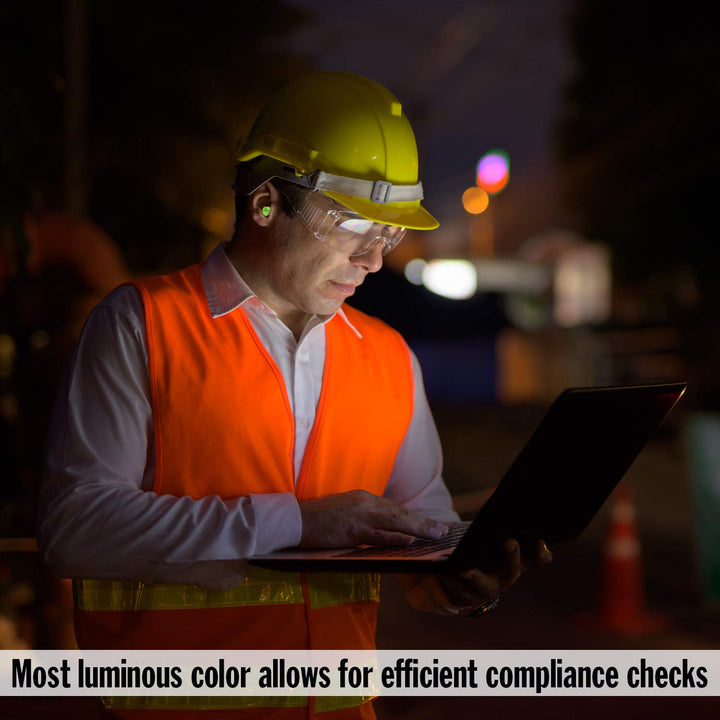 Worker wearing Mack's Hi Viz Soft Foam Earplugs NRR 32dB during industrial safety compliance check