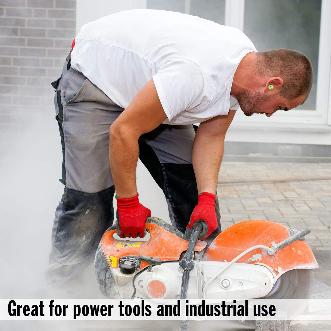 Worker using power cutter wearing Mack's Hi Viz Soft Foam Earplugs NRR 32dB for industrial noise protection