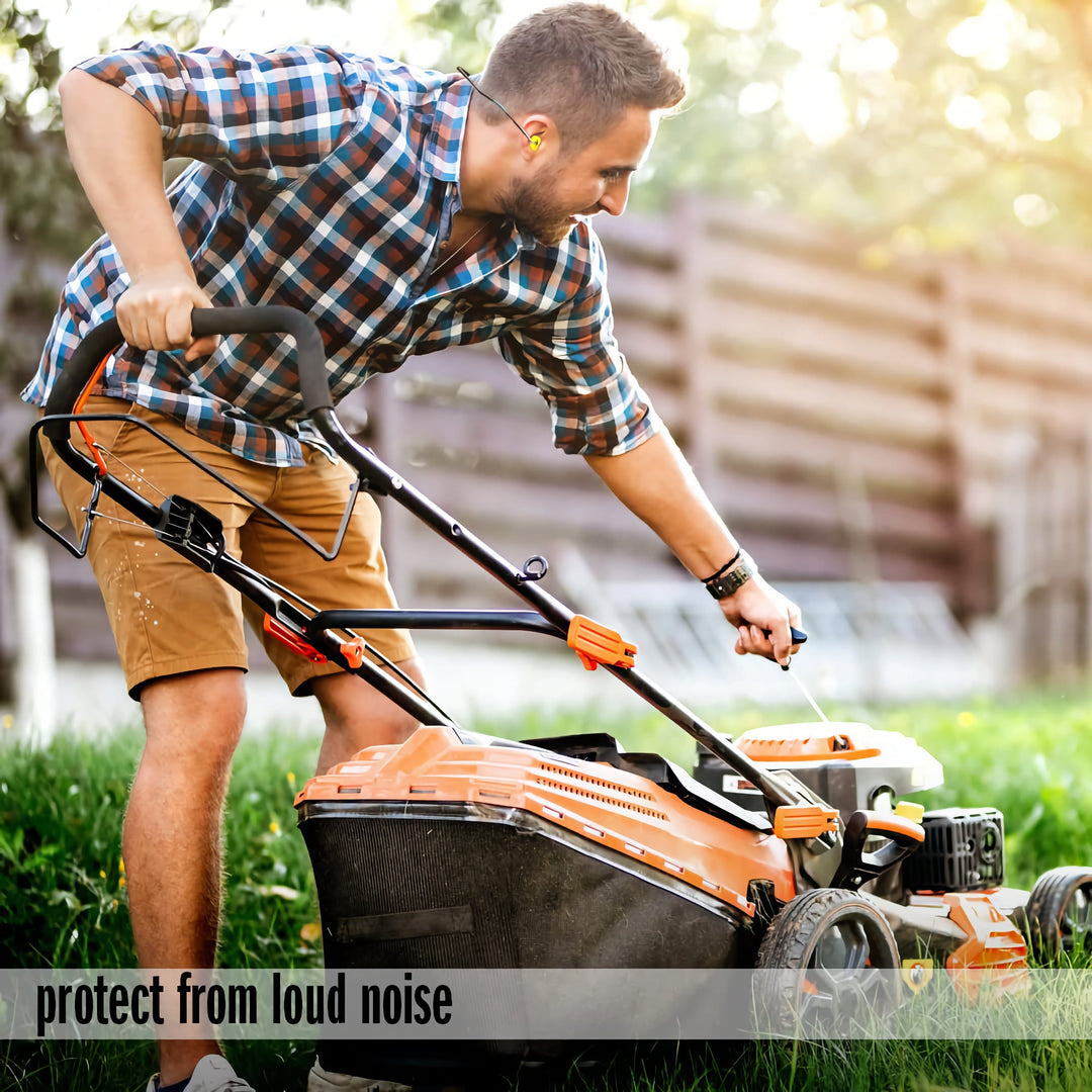 Man wearing Mack's Hi Viz Banded Foam Earplugs with fluorescent yellow-green plugs while mowing the lawn for noise protection.