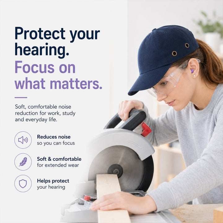 Woman using a power saw while wearing a purple foam earplug for hearing protection