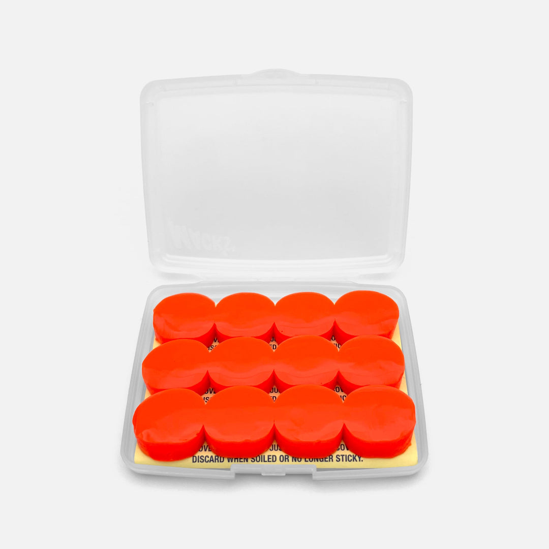 Mack's Snore Mufflers silicone putty earplugs in open travel case, showing 6 pairs of soft red moldable plugs