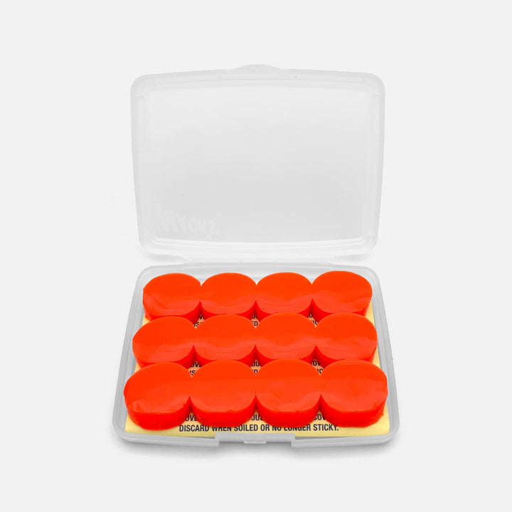 Mack's Snore Mufflers silicone putty earplugs in open travel case, showing 6 pairs of soft red moldable plugs