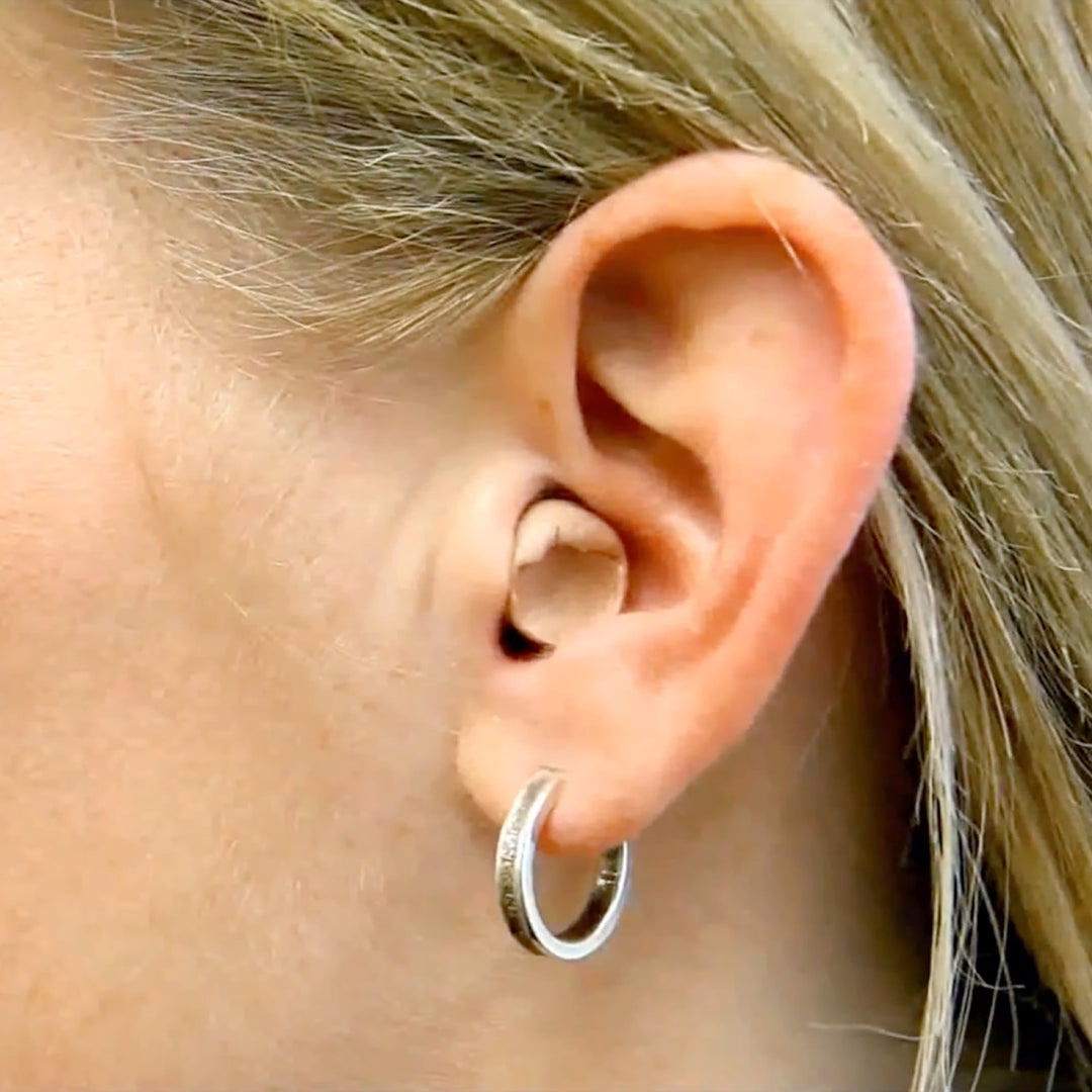 Mack's Ultra Soft Foam Earplug inserted in ear showing comfortable fit for noise protection